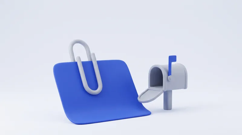 A large paperclip holding a blue document that is visibly wider than the open mailbox beside it