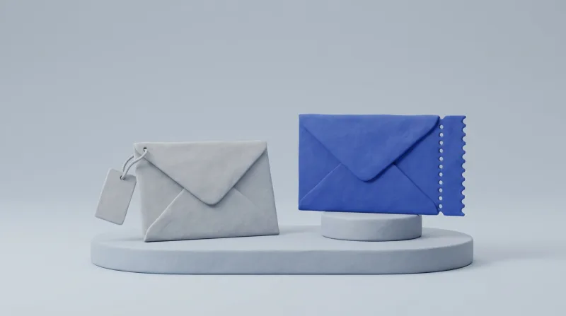 A grey envelope with a blank name tag hanging from its corner on a short cord, next to a single blue envelope with a perforated edge on a small pedestal